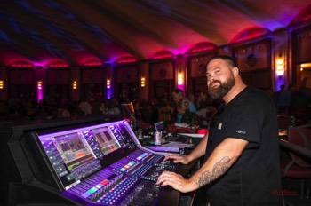  Spencer our Sound Engineer smiling after “mostly” keeping the arriving bands from playing too loud. One of our better “Sound Years.”  